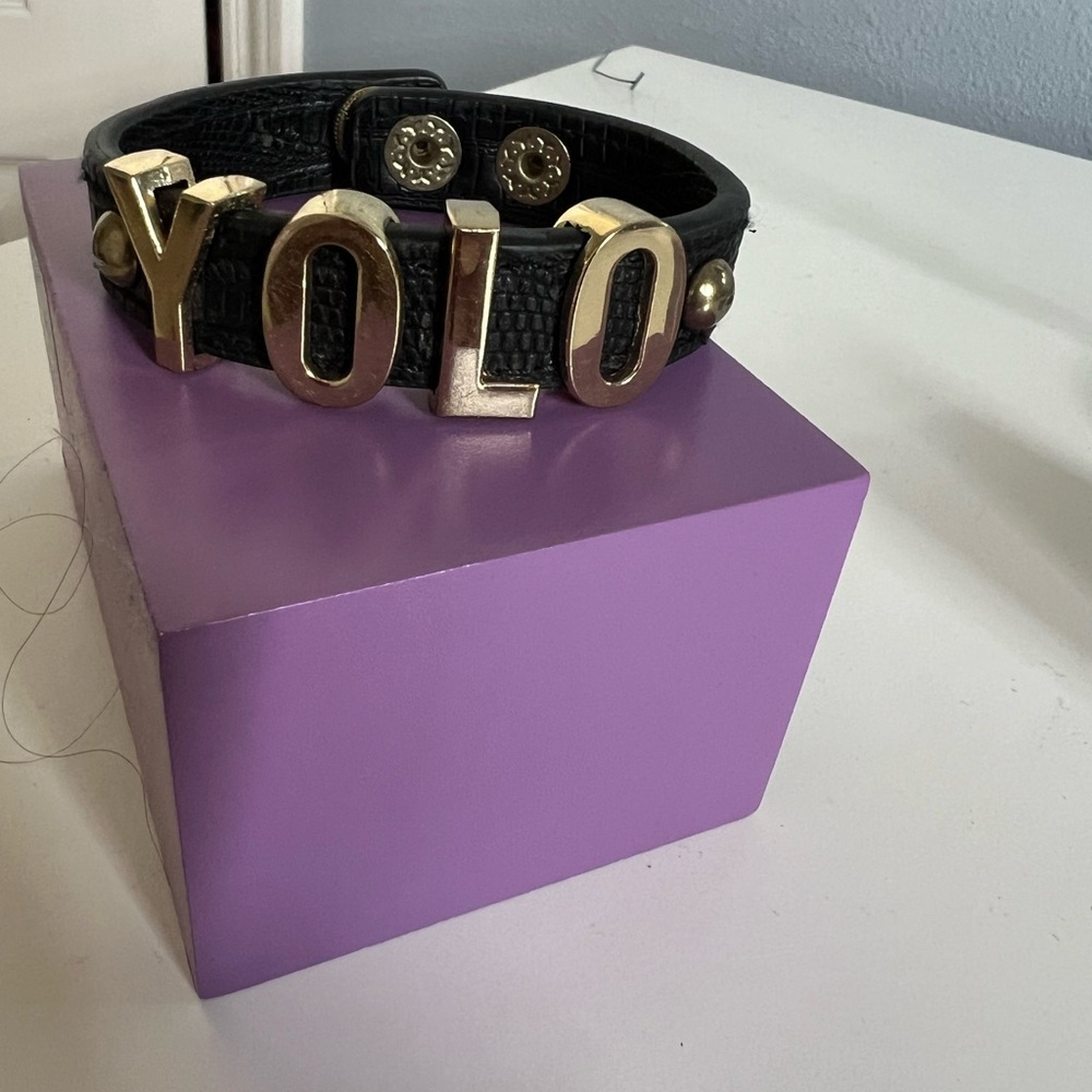 BCBGeneration Black leather YOLO bracelet with snap closure